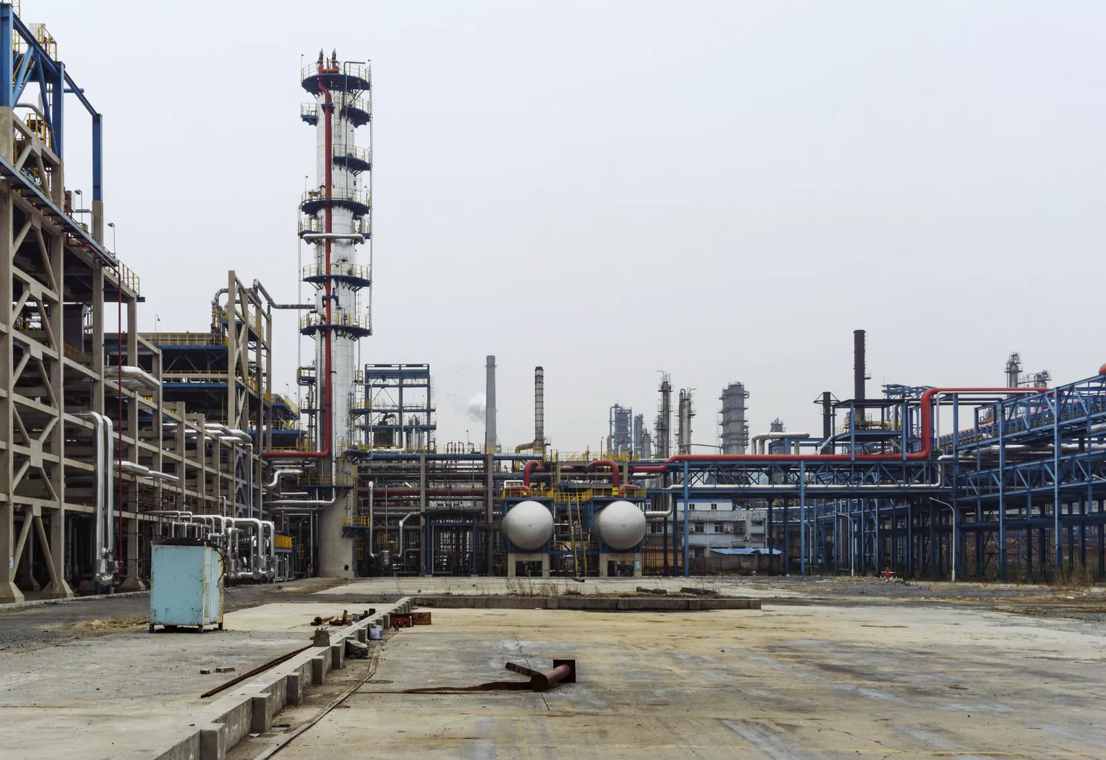 Close view of refinery pipework, valves and steel process structures